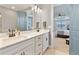 Bathroom with double vanity, and view of the main bedroom at 4210 Sunset Preserve Blvd, Orlando, FL 32820