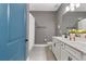 Stylish bathroom with double sinks, white cabinets, and modern fixtures at 4210 Sunset Preserve Blvd, Orlando, FL 32820