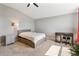 Neutral bedroom with ceiling fan features a large window that provides natural light, and is freshly carpeted at 4210 Sunset Preserve Blvd, Orlando, FL 32820