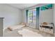 Cozy bedroom with a plush rug, comfortable bed, and sunlit window with attractive blue curtains at 4210 Sunset Preserve Blvd, Orlando, FL 32820