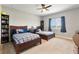 Shared bedroom with two beds, dark wood furnishings, and a ceiling fan at 4210 Sunset Preserve Blvd, Orlando, FL 32820