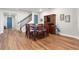 Formal dining room with a wooden table, chairs, hutch, and staircase at 4210 Sunset Preserve Blvd, Orlando, FL 32820