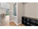 Inviting entryway with wood floors, storage cubbies, and a view to the backyard at 4210 Sunset Preserve Blvd, Orlando, FL 32820