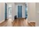 Inviting foyer with hardwood flooring and access to multiple rooms at 4210 Sunset Preserve Blvd, Orlando, FL 32820