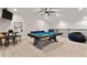 Large upstairs game room features a pool table, game table, and comfortable beanbag seating at 4210 Sunset Preserve Blvd, Orlando, FL 32820