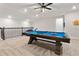 Upstairs game room features a pool table and a cozy area for leisure and relaxation at 4210 Sunset Preserve Blvd, Orlando, FL 32820
