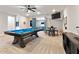 Spacious game room with a pool table, TV, and a seating area at 4210 Sunset Preserve Blvd, Orlando, FL 32820