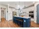 Modern kitchen featuring stainless steel appliances, a large island, and pendant lighting at 4210 Sunset Preserve Blvd, Orlando, FL 32820