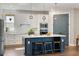 Modern kitchen featuring stainless steel appliances, a large island, and pendant lighting at 4210 Sunset Preserve Blvd, Orlando, FL 32820