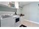 Well-equipped laundry room with modern washer and dryer and ample storage space at 4210 Sunset Preserve Blvd, Orlando, FL 32820