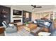Living room with fireplace and view into dining room at 4210 Sunset Preserve Blvd, Orlando, FL 32820