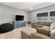 Comfortable living room with a plush sectional sofa and modern decor at 4210 Sunset Preserve Blvd, Orlando, FL 32820