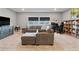 Cozy living room with a large sectional sofa, and a dedicated workspace at 4210 Sunset Preserve Blvd, Orlando, FL 32820