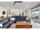 Open-concept living room with kitchen and backyard view at 4210 Sunset Preserve Blvd, Orlando, FL 32820