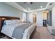 Comfortable main bedroom with ceiling fan and tray ceiling at 4210 Sunset Preserve Blvd, Orlando, FL 32820