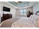 Well-lit main bedroom with large dresser and window at 4210 Sunset Preserve Blvd, Orlando, FL 32820