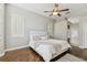 Inviting bedroom with hardwood floors, natural light, and a ceiling fan at 442 Devon Pl, Lake Mary, FL 32746