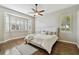 Inviting bedroom with hardwood floors, natural light, and a ceiling fan at 442 Devon Pl, Lake Mary, FL 32746