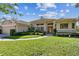 Charming one-story home with lush green lawn and meticulously landscaped front yard at 442 Devon Pl, Lake Mary, FL 32746