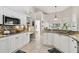 Updated kitchen with granite countertops, stainless steel appliances, and tiled backsplash at 442 Devon Pl, Lake Mary, FL 32746