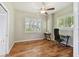 Office with hardwood floors, ceiling fan, natural light, and plantation shutters at 442 Devon Pl, Lake Mary, FL 32746