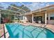 Beautiful screened-in pool with brick patio and covered lounge area for relaxed outdoor living at 442 Devon Pl, Lake Mary, FL 32746