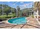 Beautiful in-ground screened pool and paver deck in backyard at 442 Devon Pl, Lake Mary, FL 32746