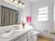 Bathroom with white countertop, tile flooring, and a large mirror at 4913 E Wind St, Orlando, FL 32812