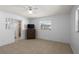 Bright bedroom with neutral walls, tile flooring, and ceiling fan at 4913 E Wind St, Orlando, FL 32812