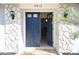 Open front door revealing the interior of the house with stone detail at 4913 E Wind St, Orlando, FL 32812