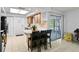 Bright kitchen with light wood cabinets, stainless steel appliances, and a breakfast bar with seating at 4913 E Wind St, Orlando, FL 32812