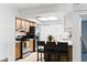 Well-lit kitchen with stainless steel appliances, breakfast bar, and tile backsplash at 4913 E Wind St, Orlando, FL 32812
