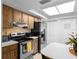 Bright kitchen with stainless steel appliances and white countertops at 4913 E Wind St, Orlando, FL 32812