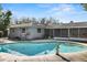 Backyard pool with a well-maintained yard at 4913 E Wind St, Orlando, FL 32812