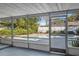 View of the pool area from the screened-in lanai at 4913 E Wind St, Orlando, FL 32812