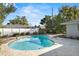 In-ground pool and outdoor living space in a lush backyard at 4913 E Wind St, Orlando, FL 32812