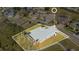 An aerial view outlines the property, complemented by neighborhood homes and mature tree landscape at 511 Coventry Rd, Davenport, FL 33897