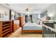 Bright bedroom with neutral walls, ceiling fan, wood furniture, and crib at 511 Coventry Rd, Davenport, FL 33897