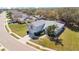Charming single-story home featuring a well-manicured lawn, attached garage, and mature trees at 511 Coventry Rd, Davenport, FL 33897
