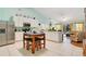 Bright eat-in kitchen with white cabinets, stainless steel appliances, and a breakfast bar at 511 Coventry Rd, Davenport, FL 33897
