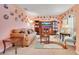 Cozy living room with neutral tones, plush seating, and unique decorative plates adorning the walls at 511 Coventry Rd, Davenport, FL 33897