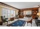 Inviting living room showcasing large windows and a stylish blue rug at 604 Darcey Dr, Winter Park, FL 32792