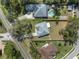 An aerial view showcases the property's location, neighboring homes, and street access at 607 S Glencoe Rd, New Smyrna Beach, FL 32168