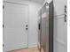 Kitchen featuring stainless steel refrigerator and sleek cabinets at 624 Illinois Ave, St Cloud, FL 34769