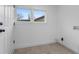 Practical laundry room area features tile flooring, window, and laundry hook-ups at 624 Illinois Ave, St Cloud, FL 34769