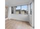 Cozy sunroom with wood-look flooring and multiple windows providing natural light at 624 Illinois Ave, St Cloud, FL 34769