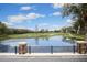 Scenic view of the golf course and pond from the community's viewing area at 6425 Streamport Dr, Orlando, FL 32822