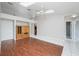 Spacious living room featuring tile and wood-look floors, plus a built-in cabinet at 6425 Streamport Dr, Orlando, FL 32822