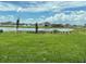 Beautiful backyard with views of a tranquil pond and surrounding green space at 6920 Dappled Oak Way, Orlando, FL 32829