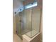 Contemporary walk-in shower featuring stylish tile work and a glass enclosure at 6920 Dappled Oak Way, Orlando, FL 32829